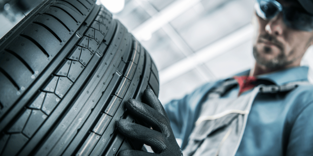 A picture of a car's tire, showing the tread and the sidewall.